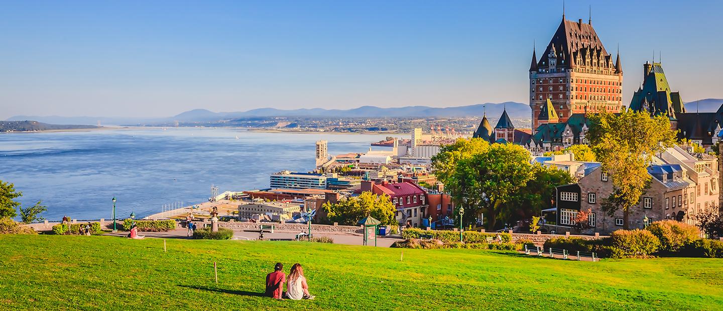 A photo overlooking the city of Quebec and a coastline.